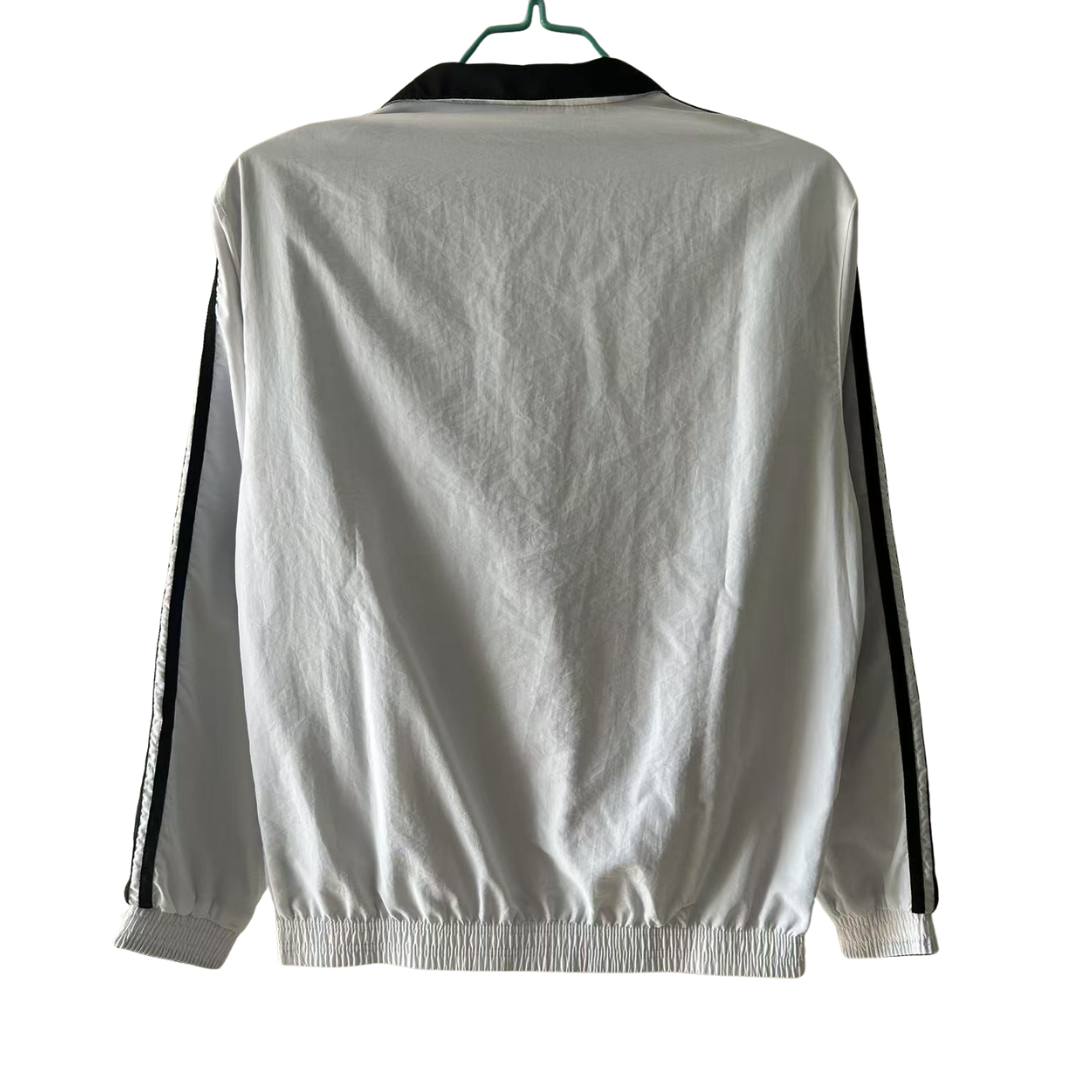 BAJO ENCARGO CHAQUETA REAL MADRID ROMPEVIENTOS REVERSIBLE