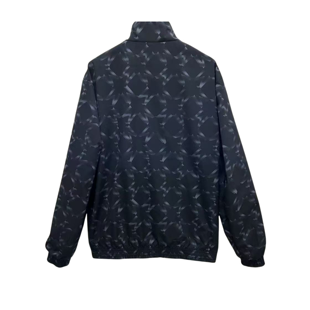 BAJO ENCARGO CHAQUETA MANCHESTER UNITED ROMPEVIENTOS REVERSIBLE