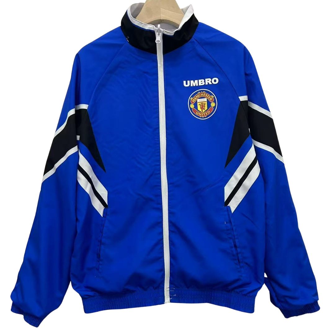 BAJO ENCARGO CHAQUETA MANCHESTER UNITED ROMPEVIENTOS REVERSIBLE