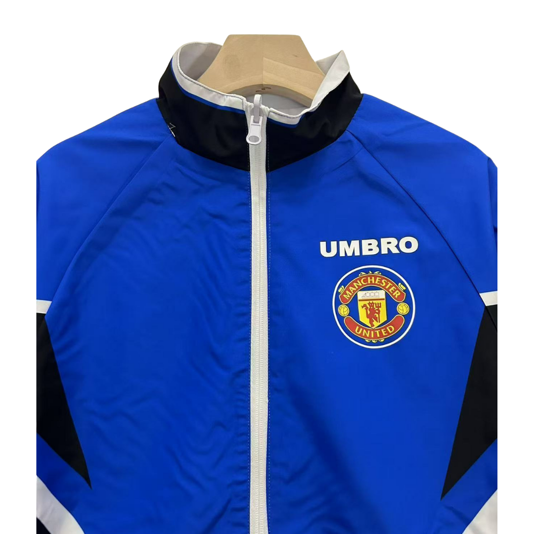 BAJO ENCARGO CHAQUETA MANCHESTER UNITED ROMPEVIENTOS REVERSIBLE