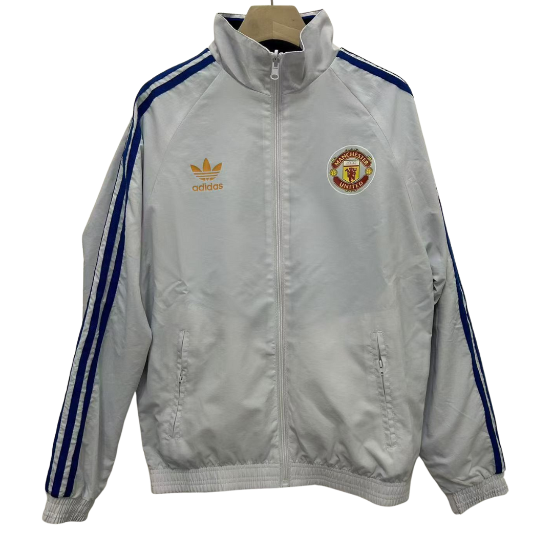 BAJO ENCARGO CHAQUETA MANCHESTER UNITED ROMPEVIENTOS REVERSIBLE