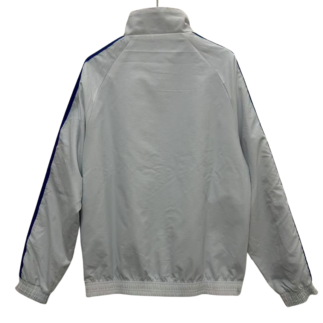 BAJO ENCARGO CHAQUETA MANCHESTER UNITED ROMPEVIENTOS REVERSIBLE